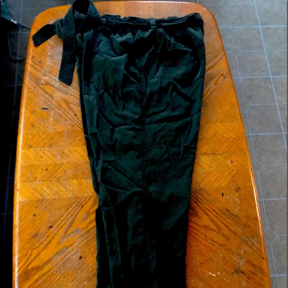 Women’s green slacks with tie belt